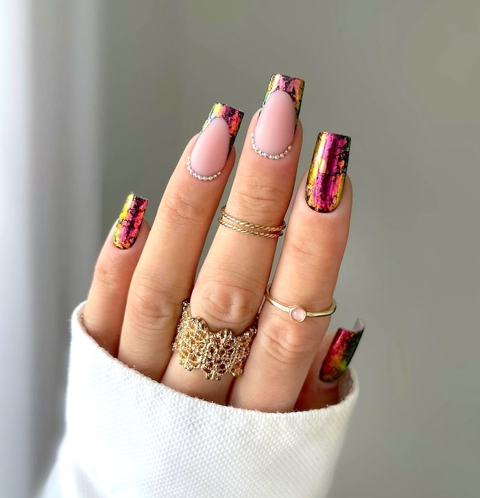 Multi-color distressed chrome nails.