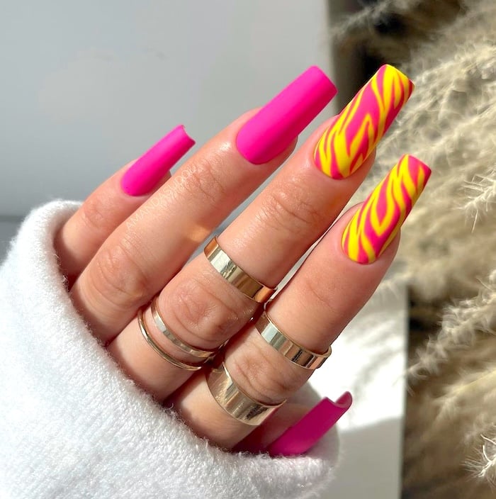 Pink and yellow stripe neon nails.