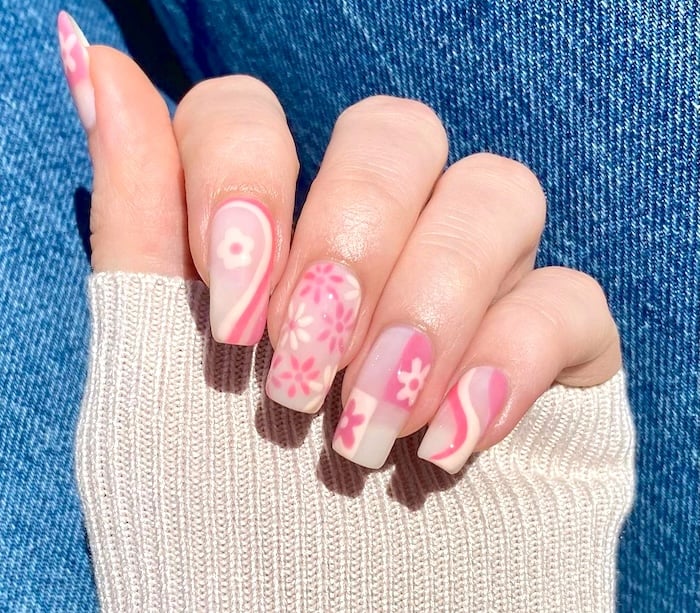 Pink and white nails art on long square nails.