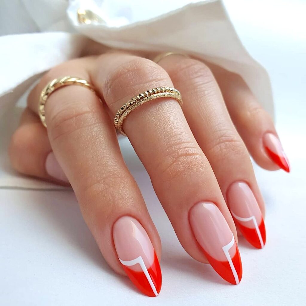 Flame red French tip nails.