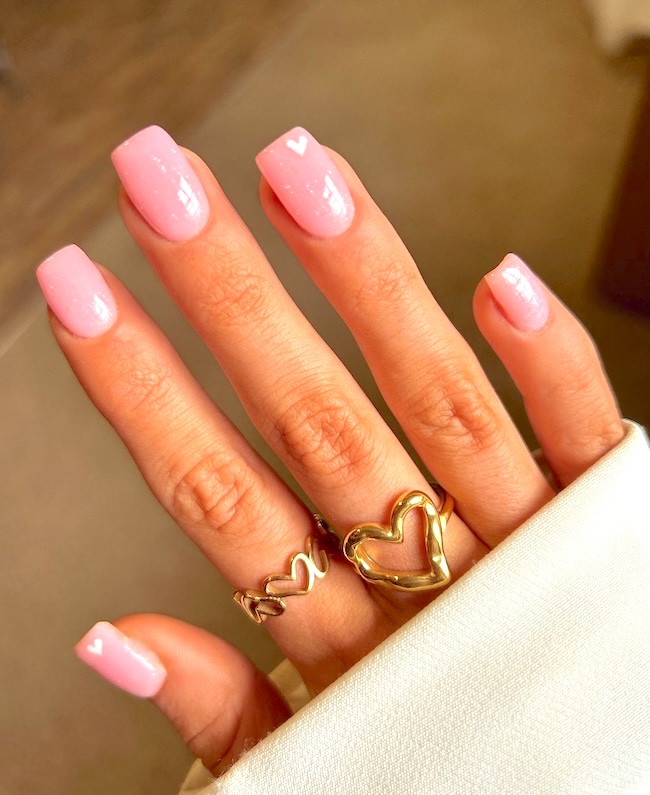 Minimalist pink heart nails.