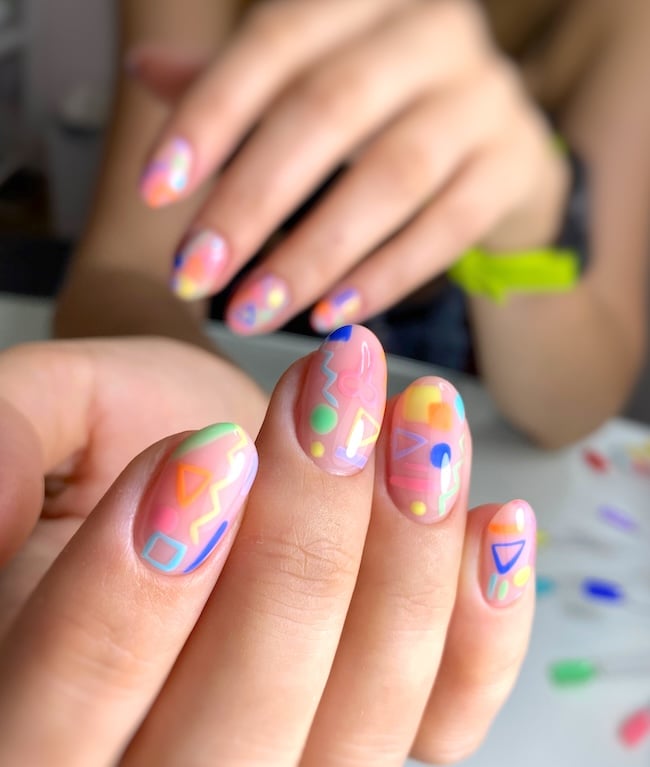 Bright summer nail art on almond-nails.