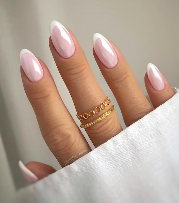 Pink chrome French tip nails.