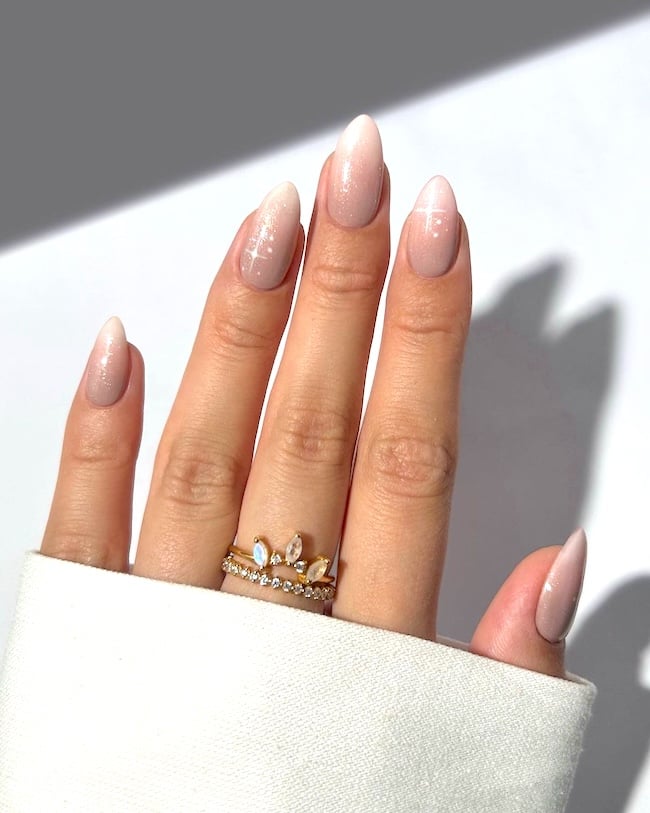 Sparkly nude nails.