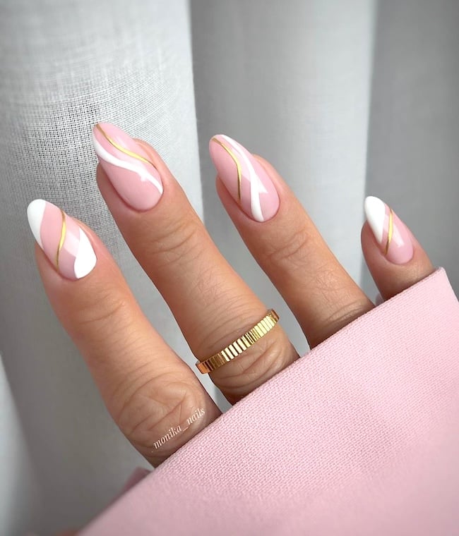 Pink, white and gold nails.