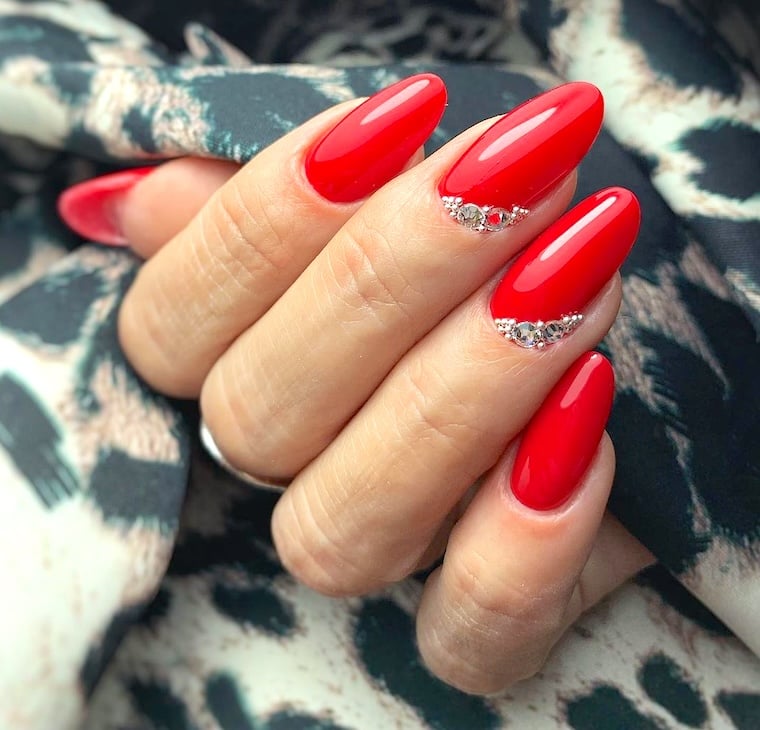 Red rhinestone nails.