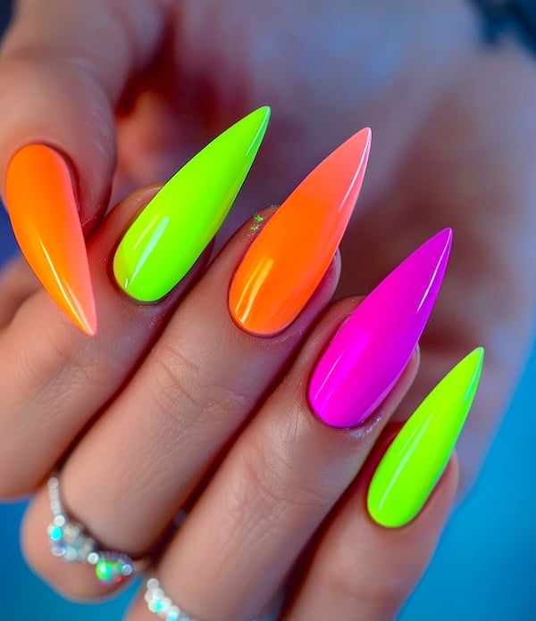 Stiletto bright neon nails.