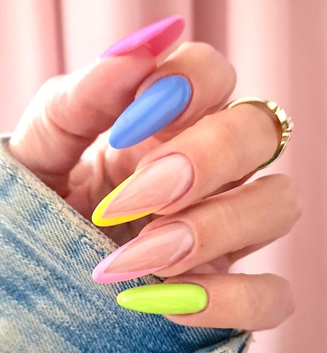 Sharp long multi-color April nails.