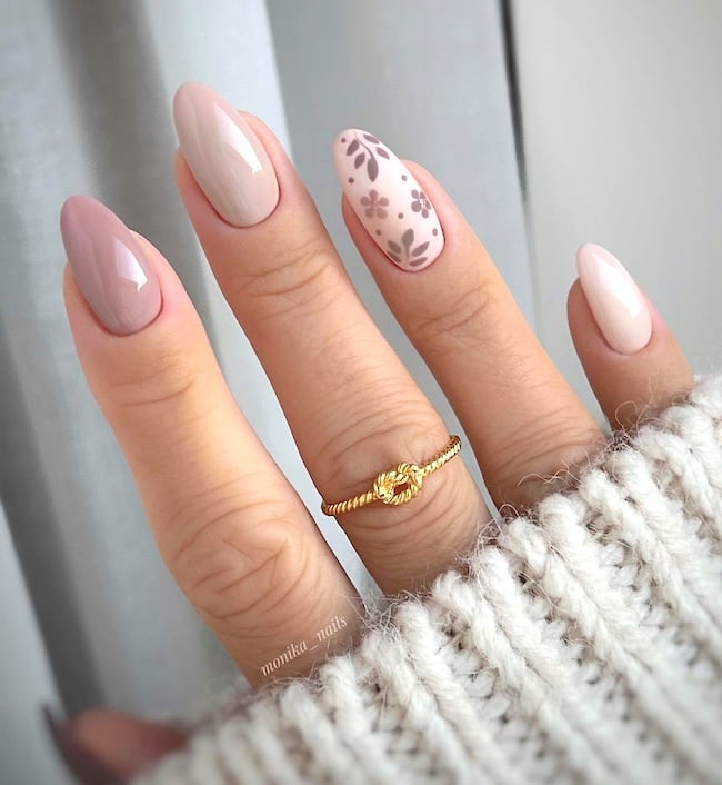 Nude floral nails.