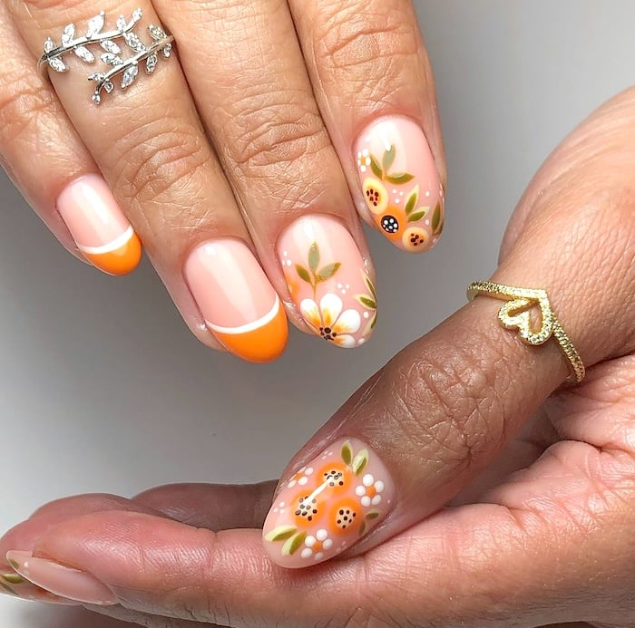 Orange floral May nails.