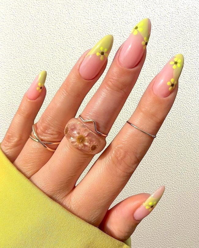 Yellow French tip April nails.