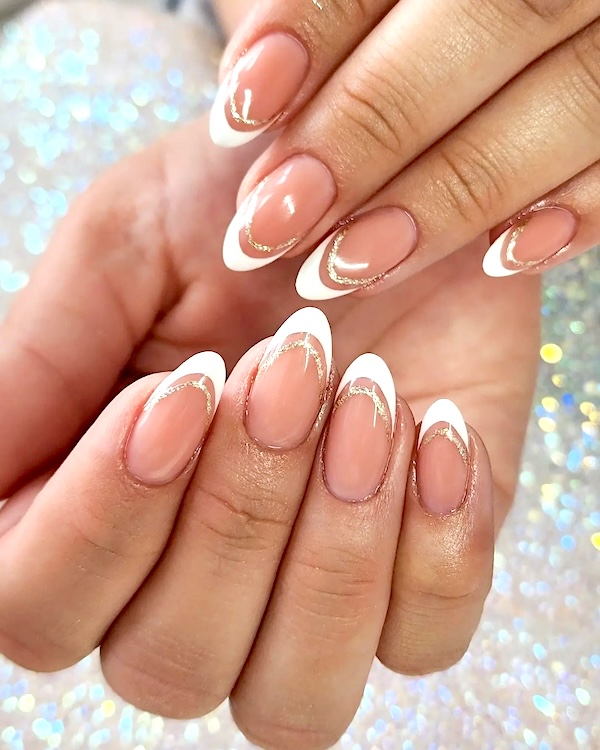 Gold lines French tip nails.