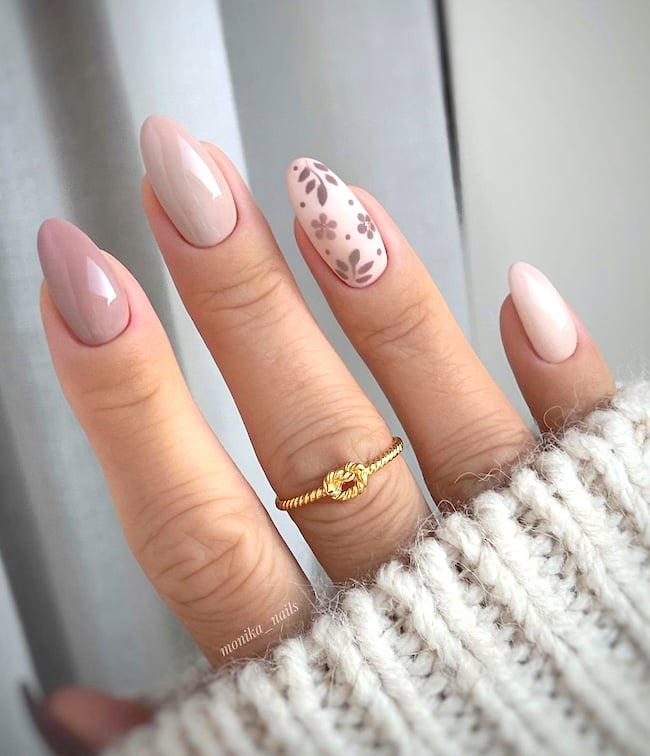 Neutral floral almond nails.