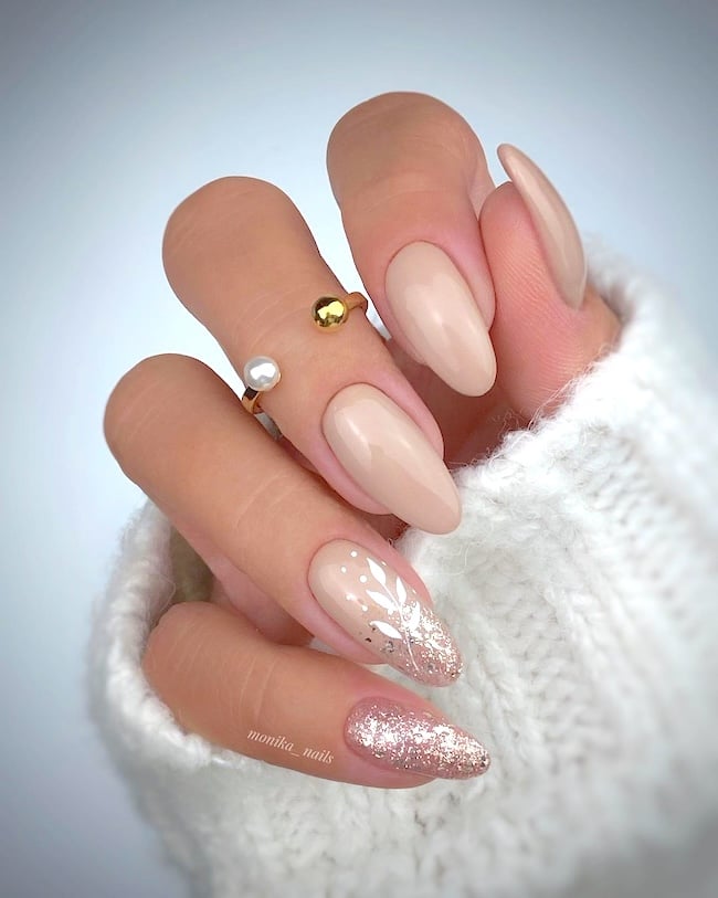 Nude glitter nails.