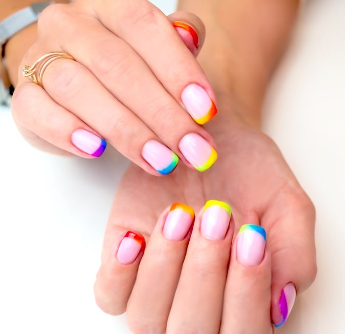 Bright rainbow French tip square nails for summer.