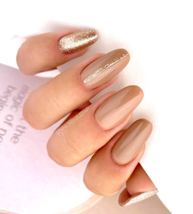 Gold nude nails.