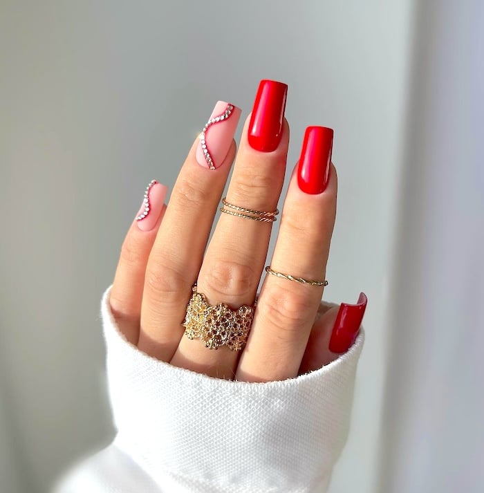 Red rhinestone nails.