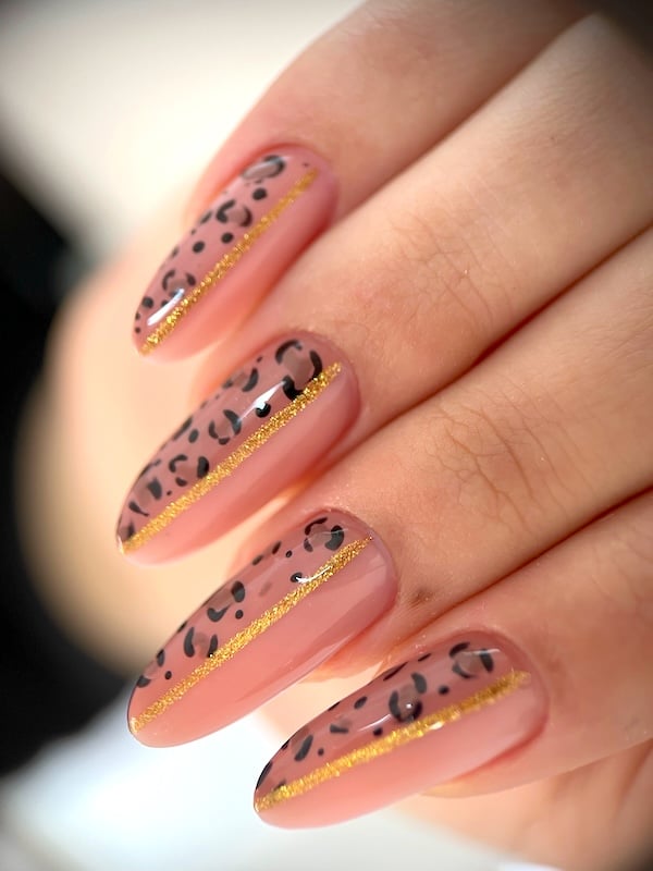 Nude leopard nails.