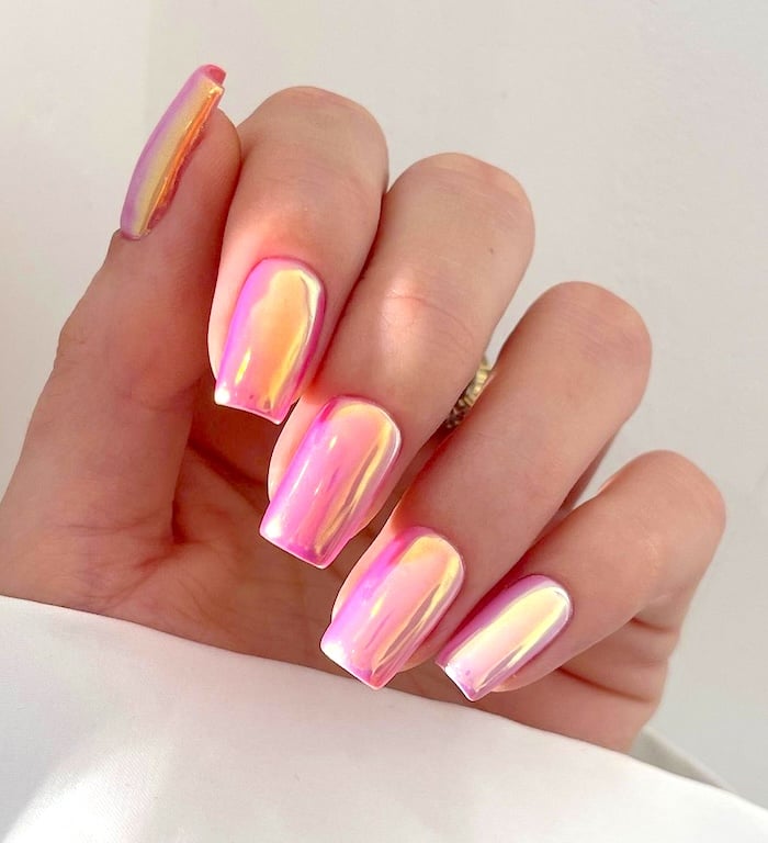 Pink chrome nails.