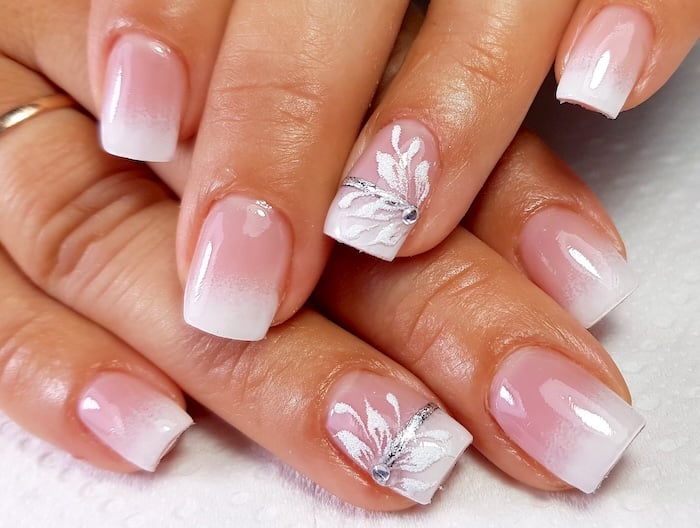 Floral French tip nails.