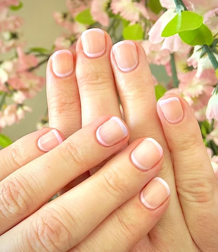 Short pastel cuff and French tip nails.