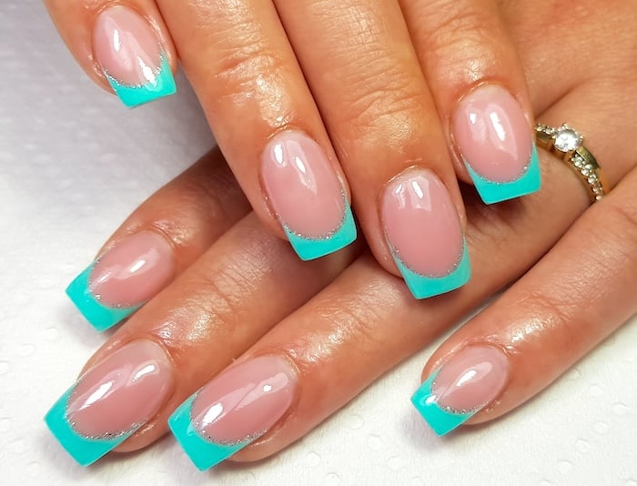 Aqua green square French tip nails.