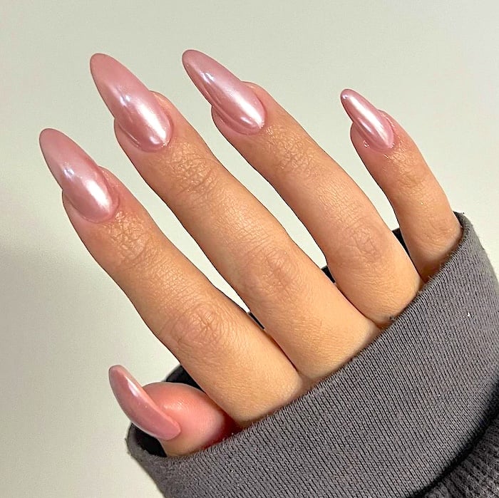 Pink chrome nails.