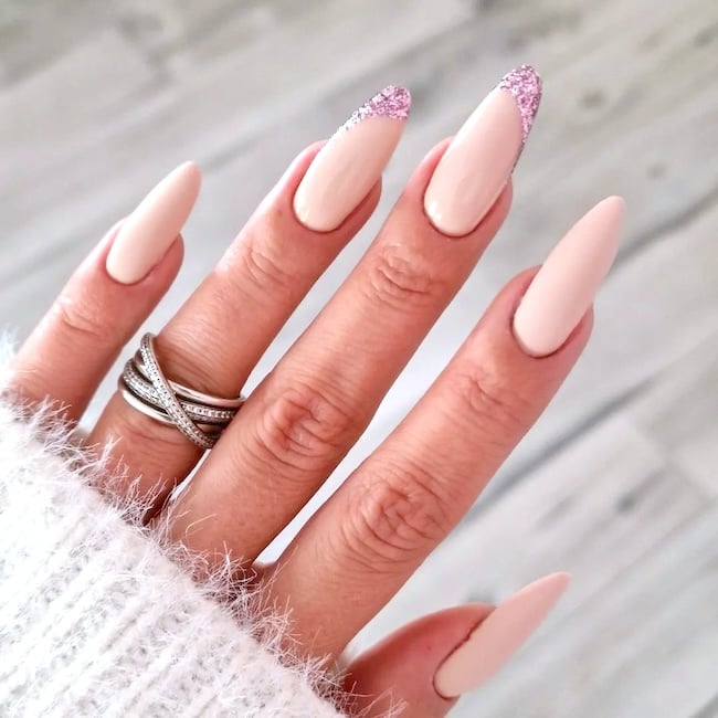 Light nude nails with pink litter.