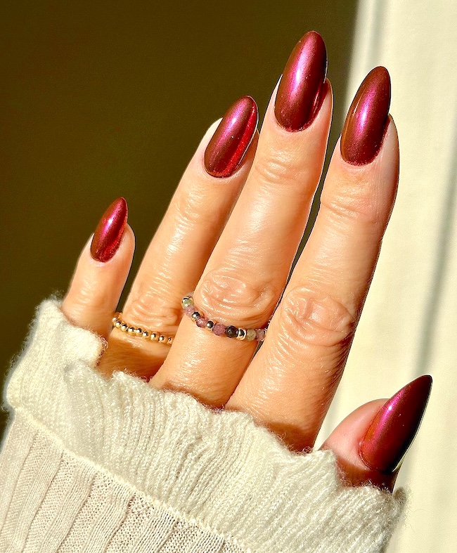 Golden red shimmer nails.