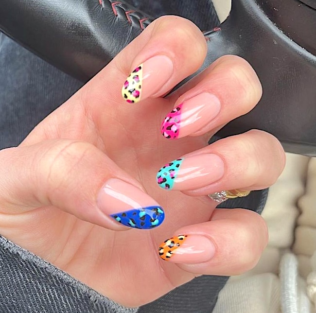 Neon-animal print French tip nails.