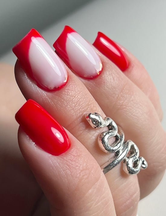 Red French tip manicure.