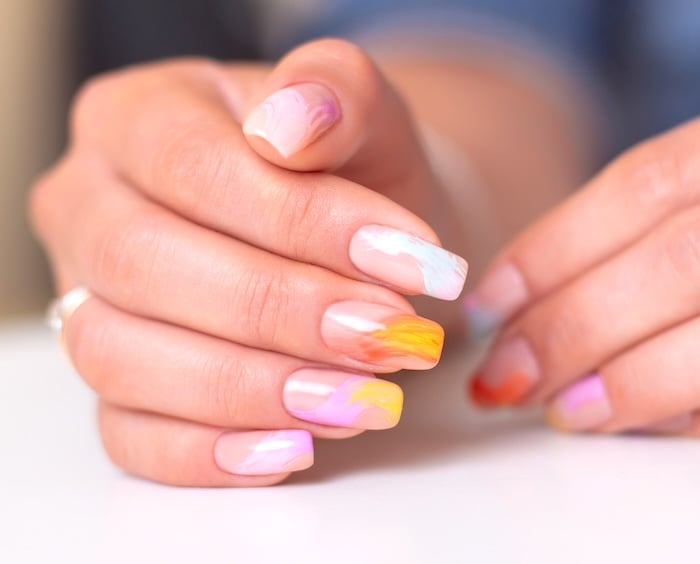 Bright paintbrush summer nails.