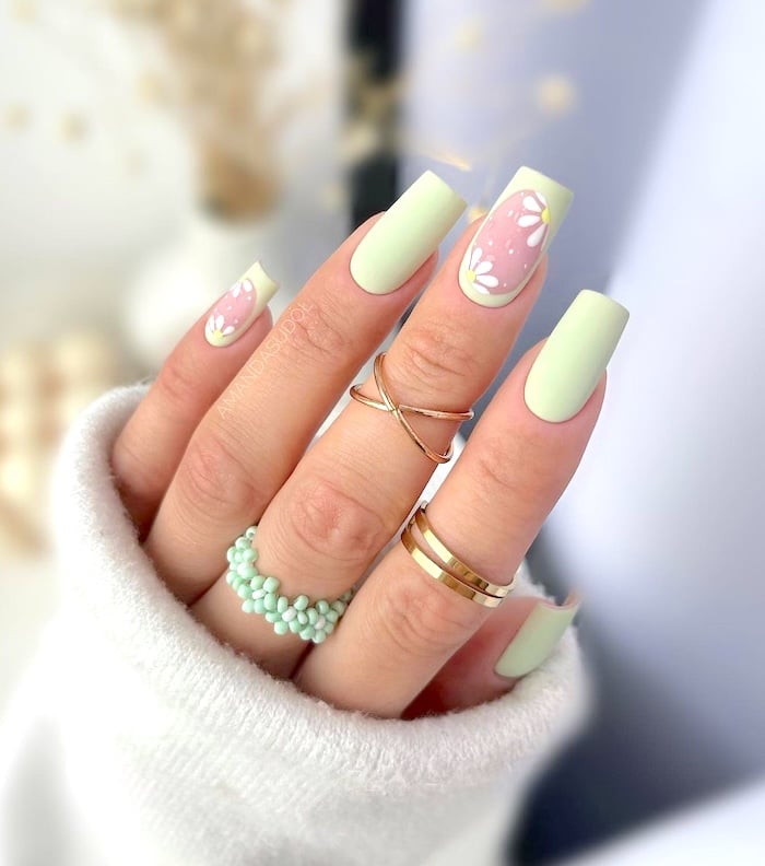 Pale mint green April nails.