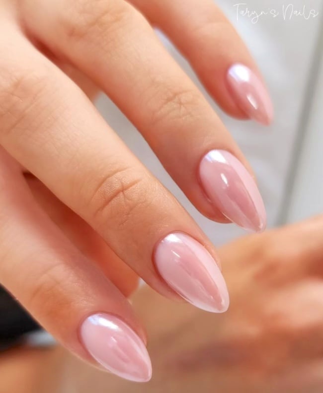 Pink almond chrome nails.