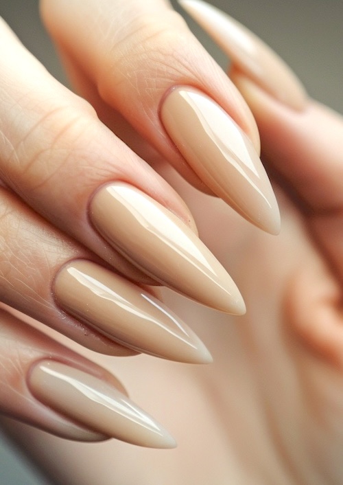 Sharp nude almond nails.