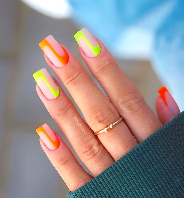 Lime orange lines neon nails.