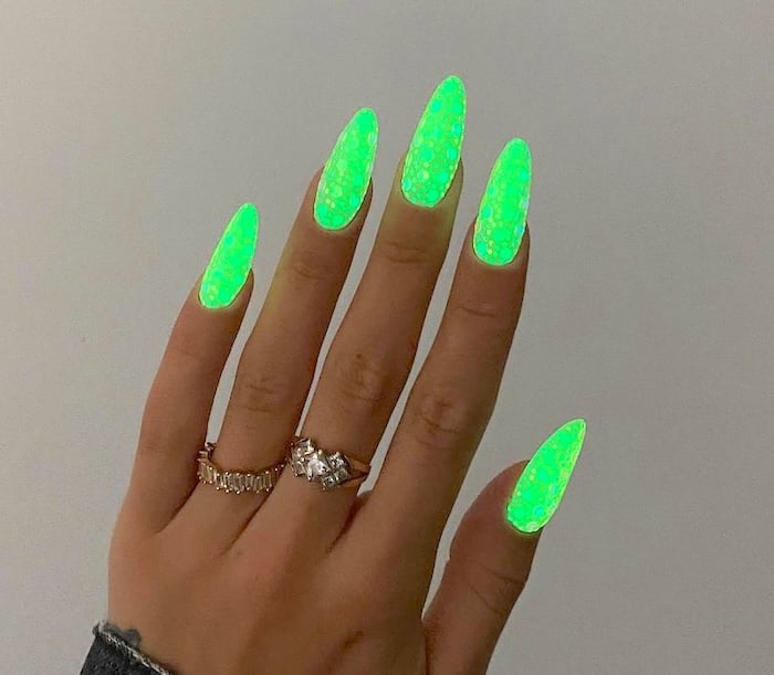 Fluorescent extra bright electric green neon nails.