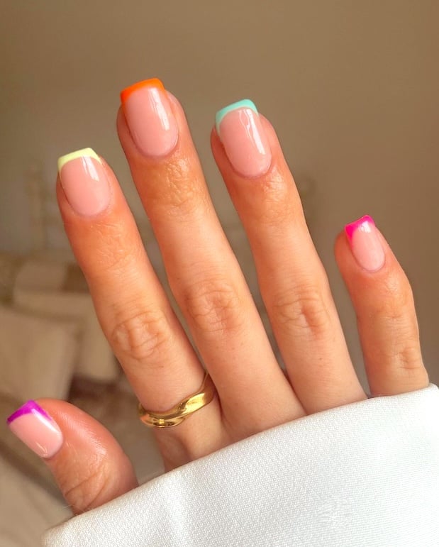 Bright French tip manicure.