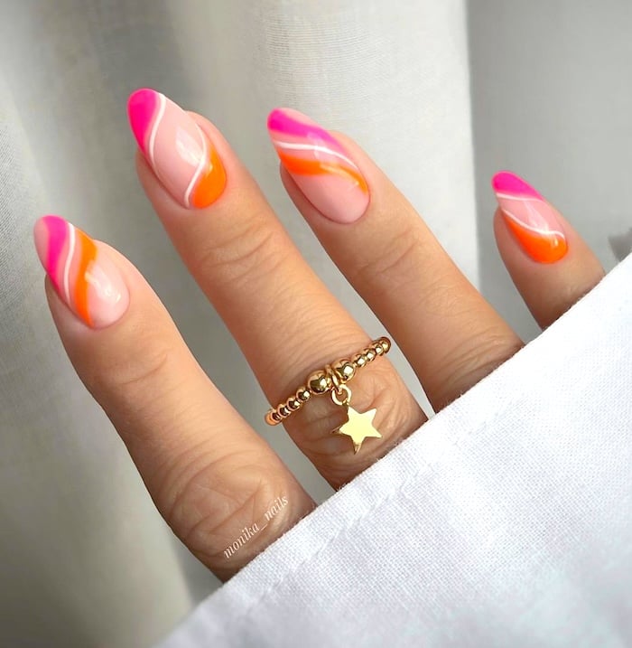 Pink and orange neon swirl nails.