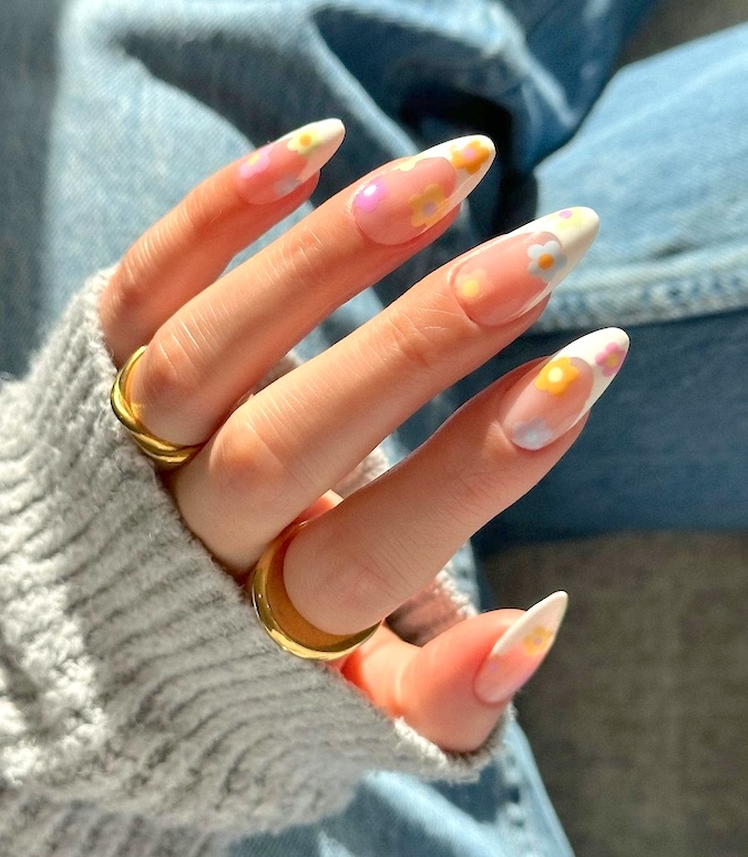 Pastel floral French tip April nails.