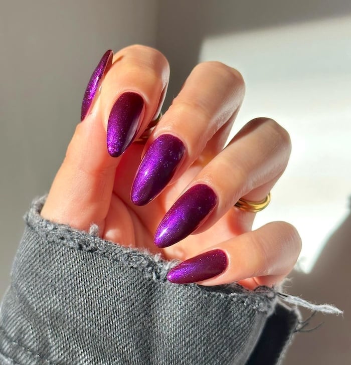 Purple chrome nails.