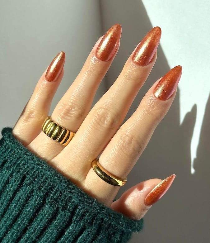 Bronze chrome nails.