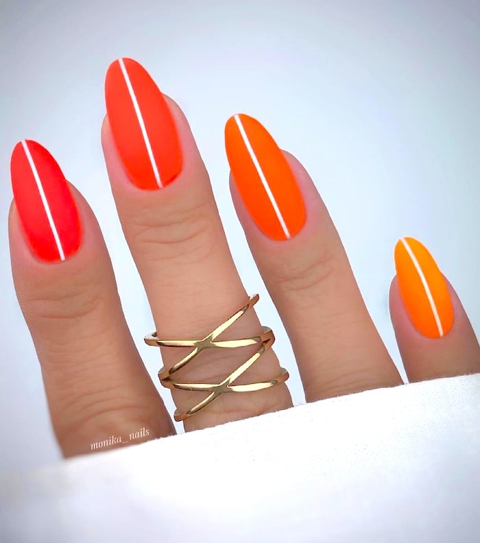 Orange neon line nails.