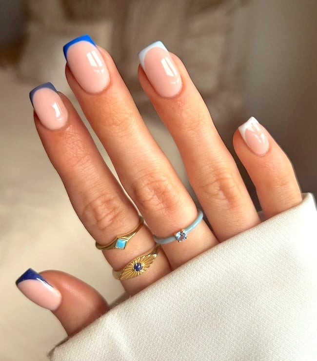 Blue French tip nails.