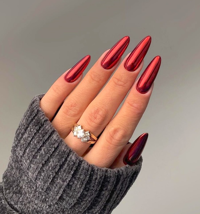 Chrome red almond nails.