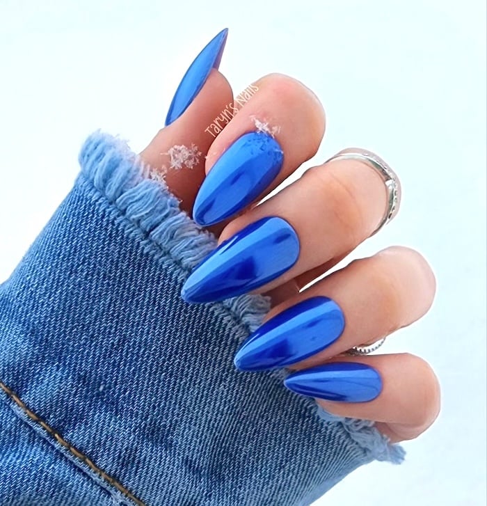 Bright blue metallic chrome nails.