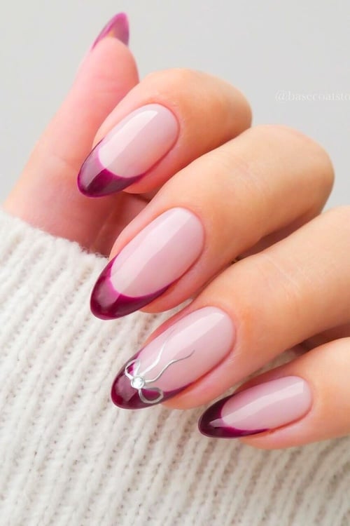 Plum French tip nails.