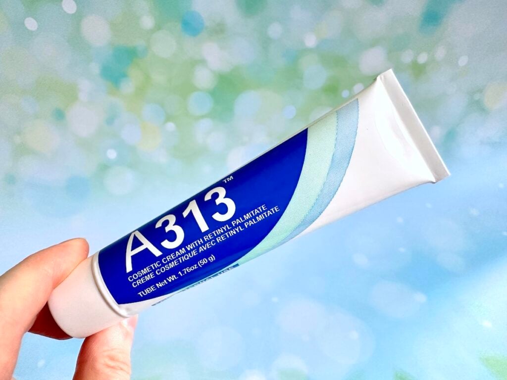 A313 Cosmetic Cream With Retinyl Palmitate, handheld.