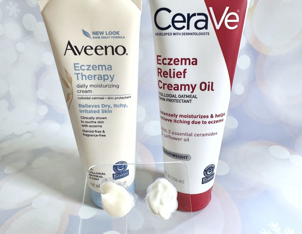 Aveeno Eczema Therapy Daily Moisturizing Cream and CeraVe Eczema Relief Creamy Oil, with samples on clear spatula palette.