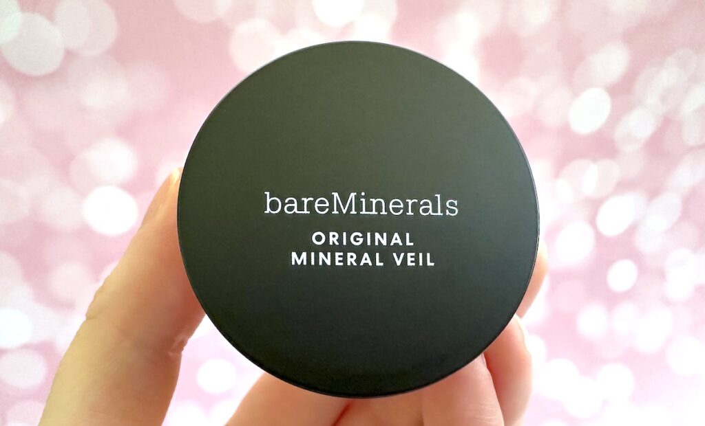 bareMinerals Original Mineral Veil Loose Setting Powder in the shade Original Translucent, handheld.